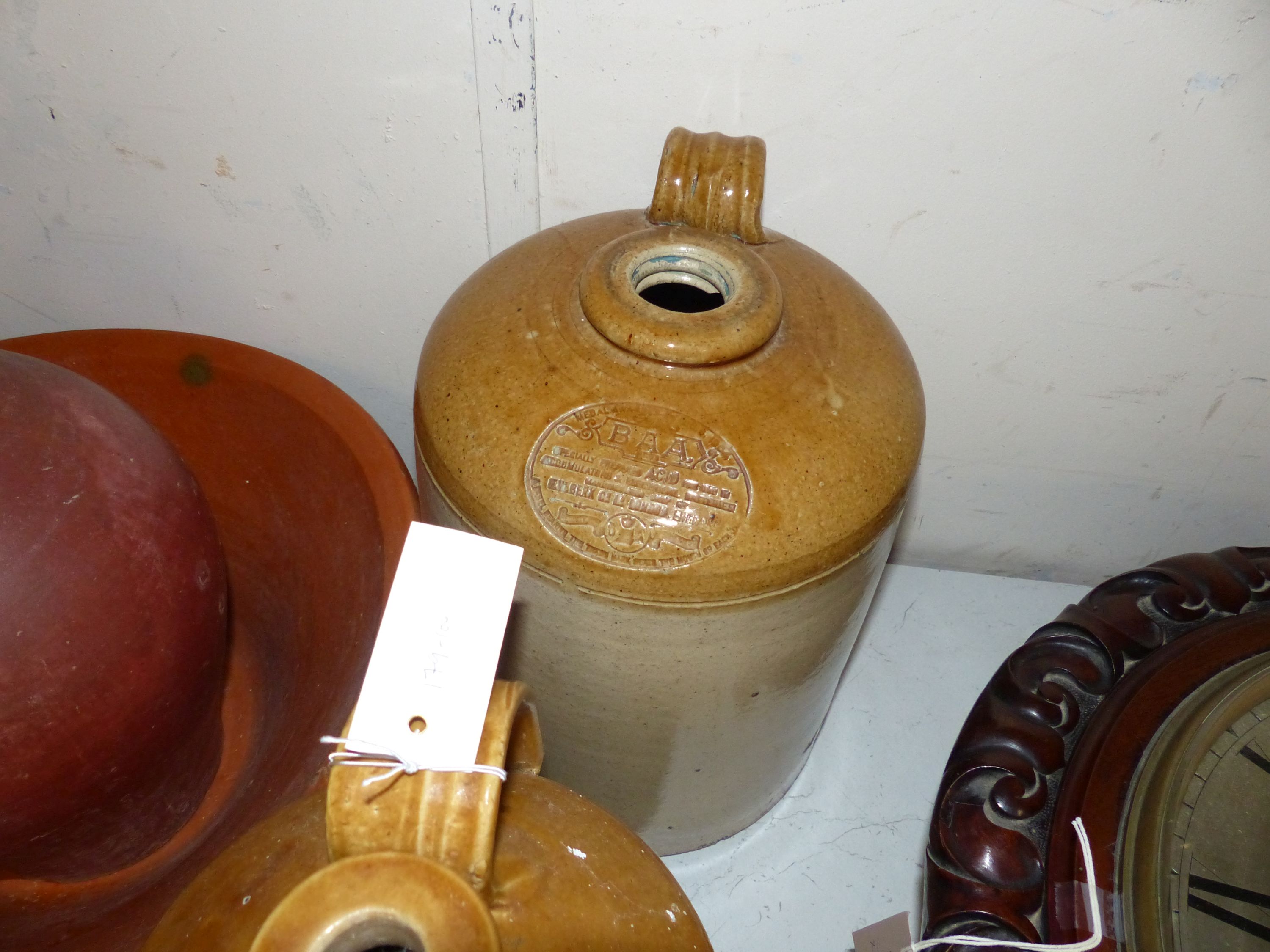 Stoneware flagons and a terracotta dairy bowl